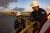 Two bp team members at the Atlantis offshore platform in the Gulf of America