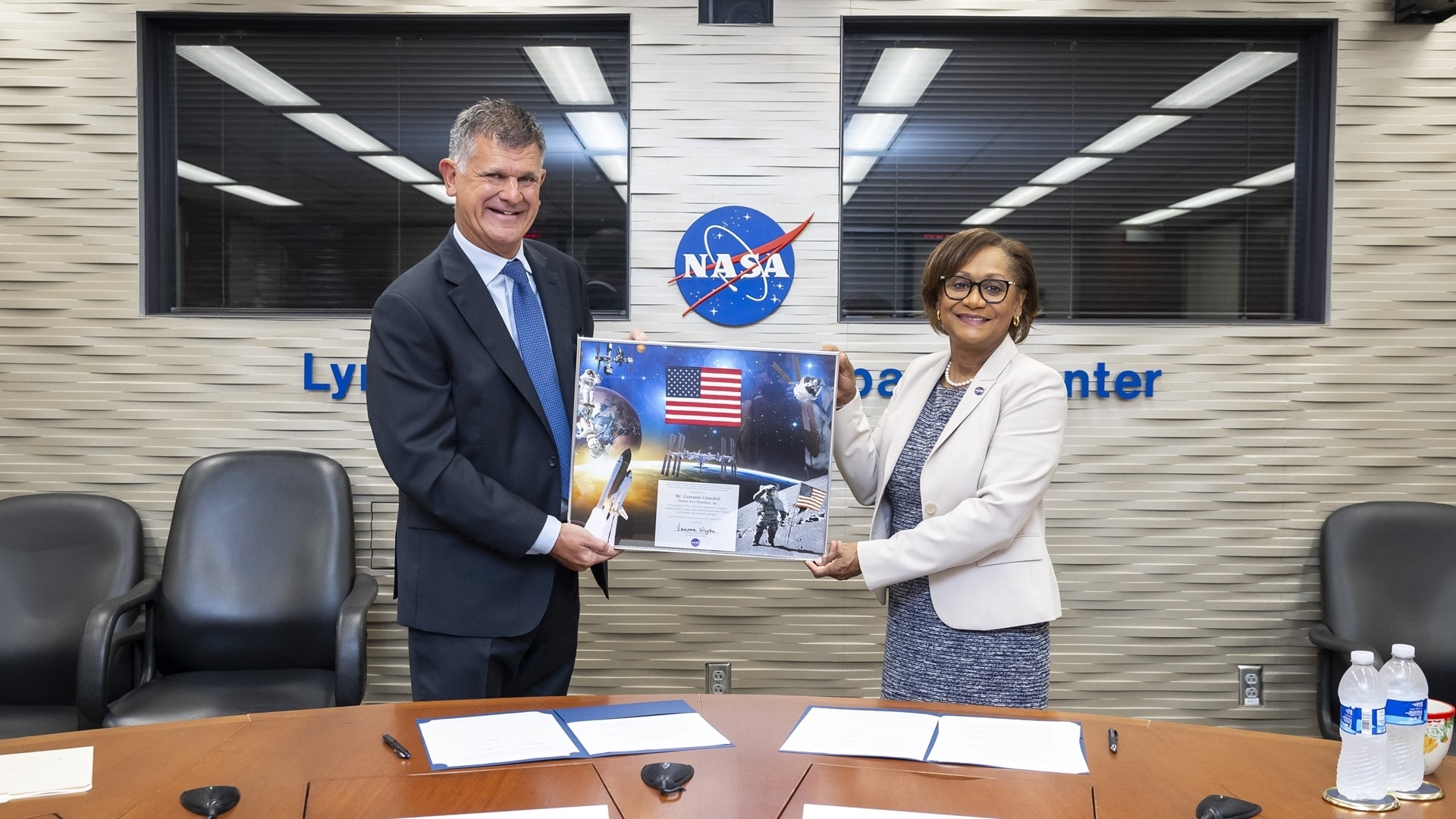 Giovanni Cristofoli, SVP of bp Solutions, and Vanessa Wyche, Director of NASA's Johnson Space Center, sign a Space Act Agreement between bp and NASA on Wednesday, August 7, 2024.